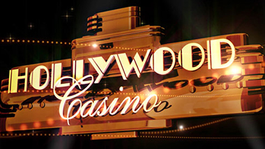 A gold-colored Marquee showing the Hollywood Casino sign.